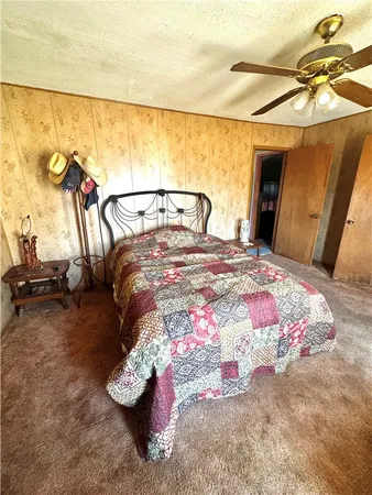 a bedroom with a bed and a mirror