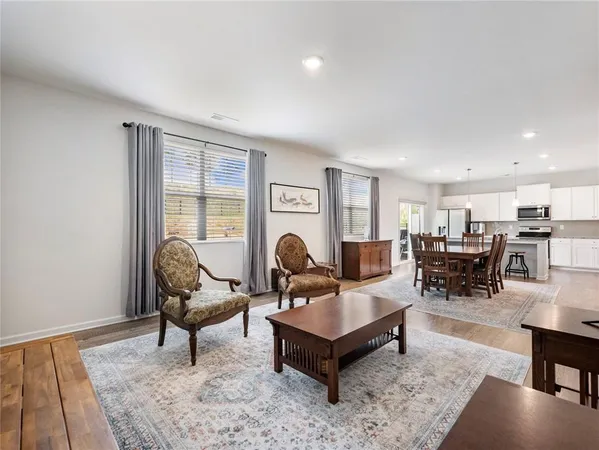 a living room with furniture and a rug