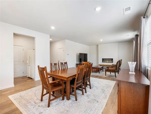 a kitchen with kitchen island granite countertop a sink a counter space appliances and cabinets