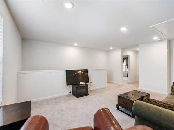 a spacious bedroom with a bed and a window