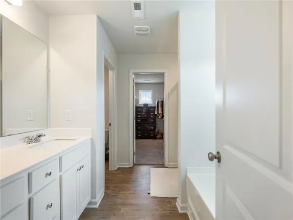 a bathroom with a toilet and a sink