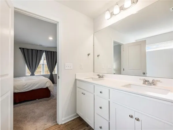 a view of walk in closet with clothes