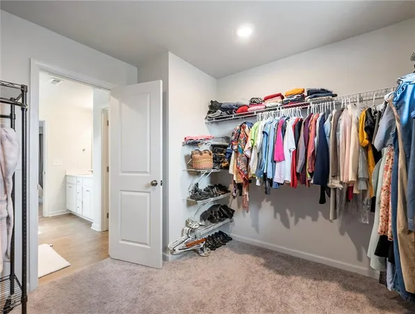a bedroom with a bed and a table