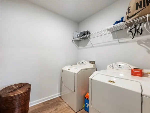 a room with furniture a air conditioner vent and a window