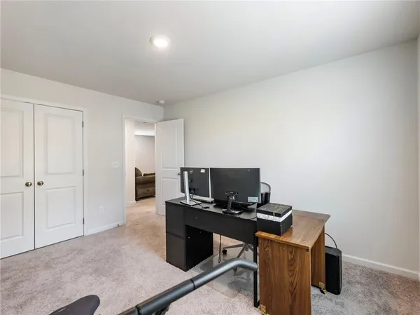 a view of a house with a snow on the road