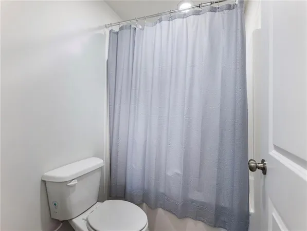 a view of a lake with houses in the back