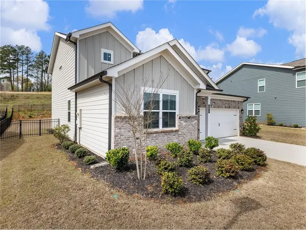 a view of large white house with a yard