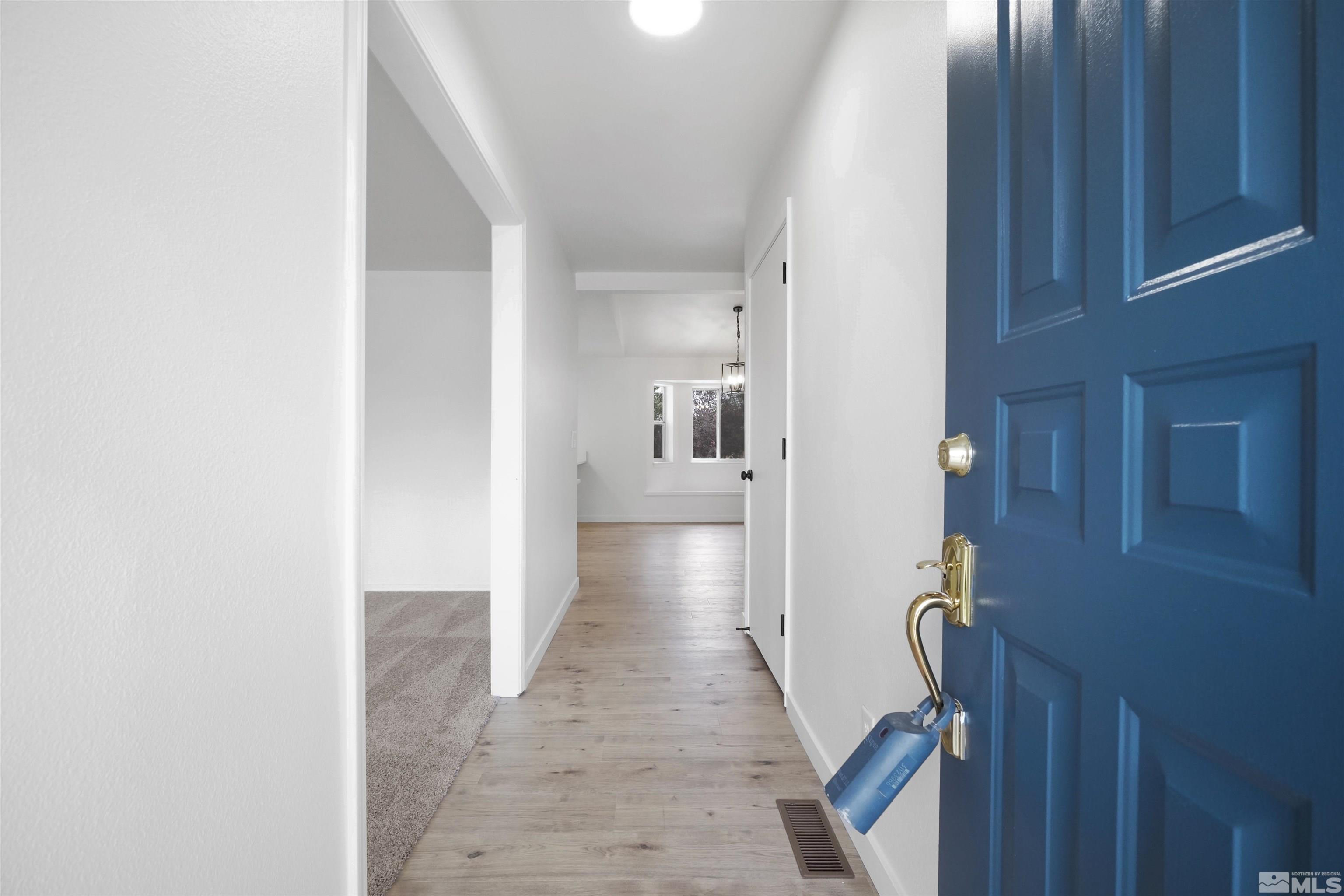 4046 Cimarron Road Fallon, NV 89406 - Photo 6 of 30 a view of a hallway with a wooden cabinets