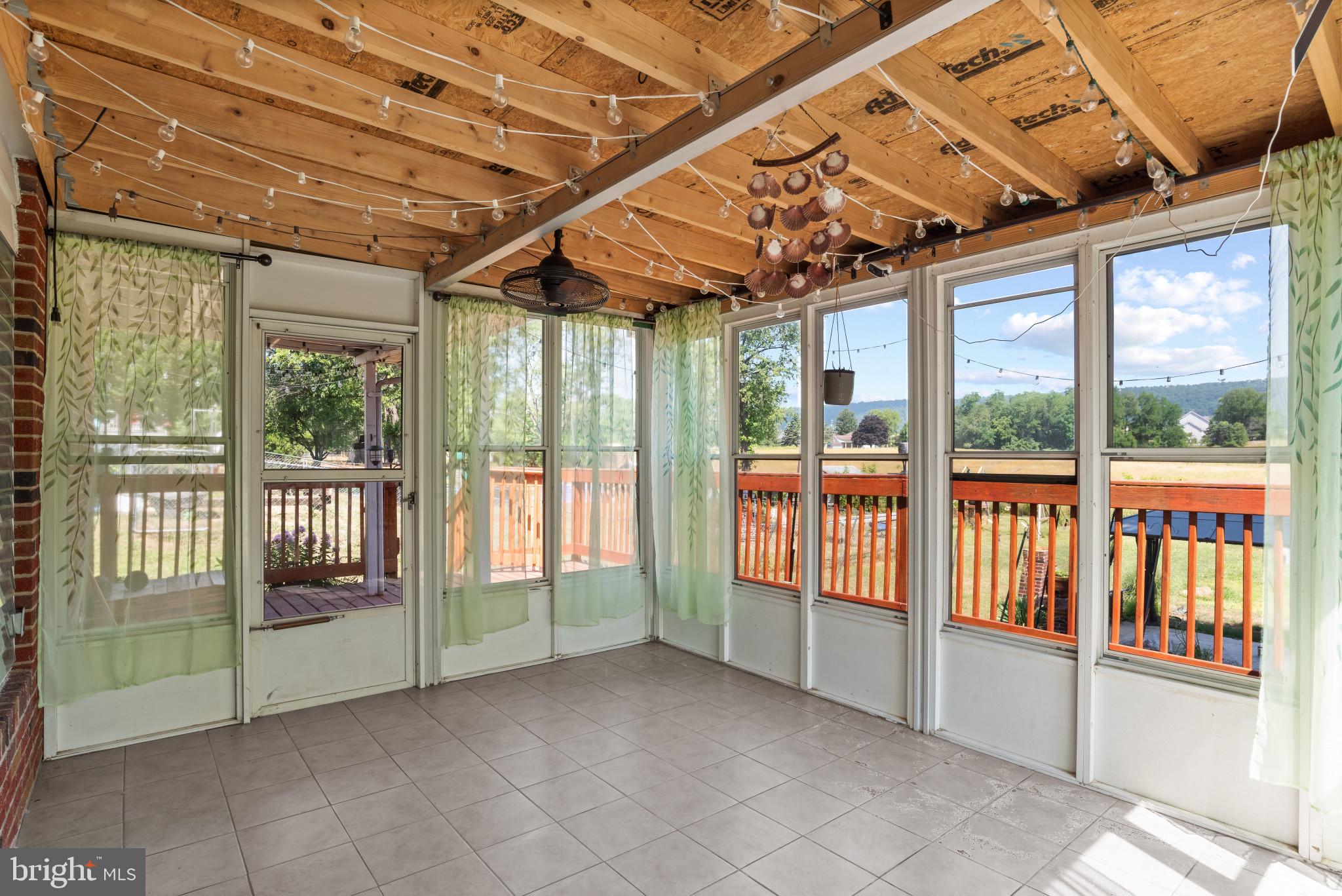 14 Sharon Road Enola, PA 17025 - Photo 30 of 40 Screened porch featuring light tile flooring and e