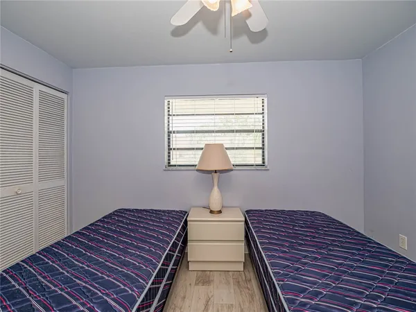 a bedroom with bed and a window
