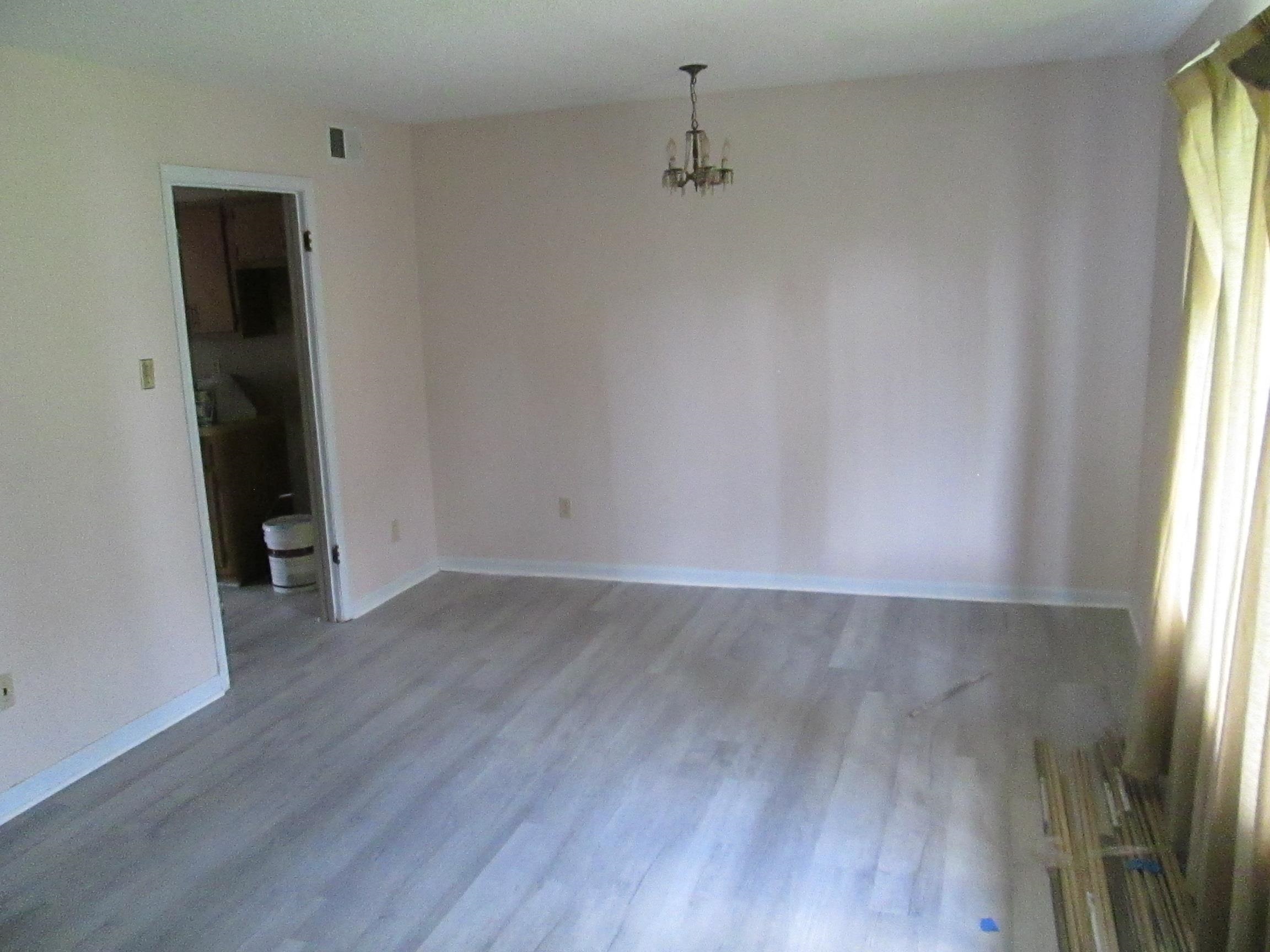 5252 Johns River Road, Unit 5252 Memphis, TN 38116 - Photo 12 of 12 an empty room with wooden floor and windows