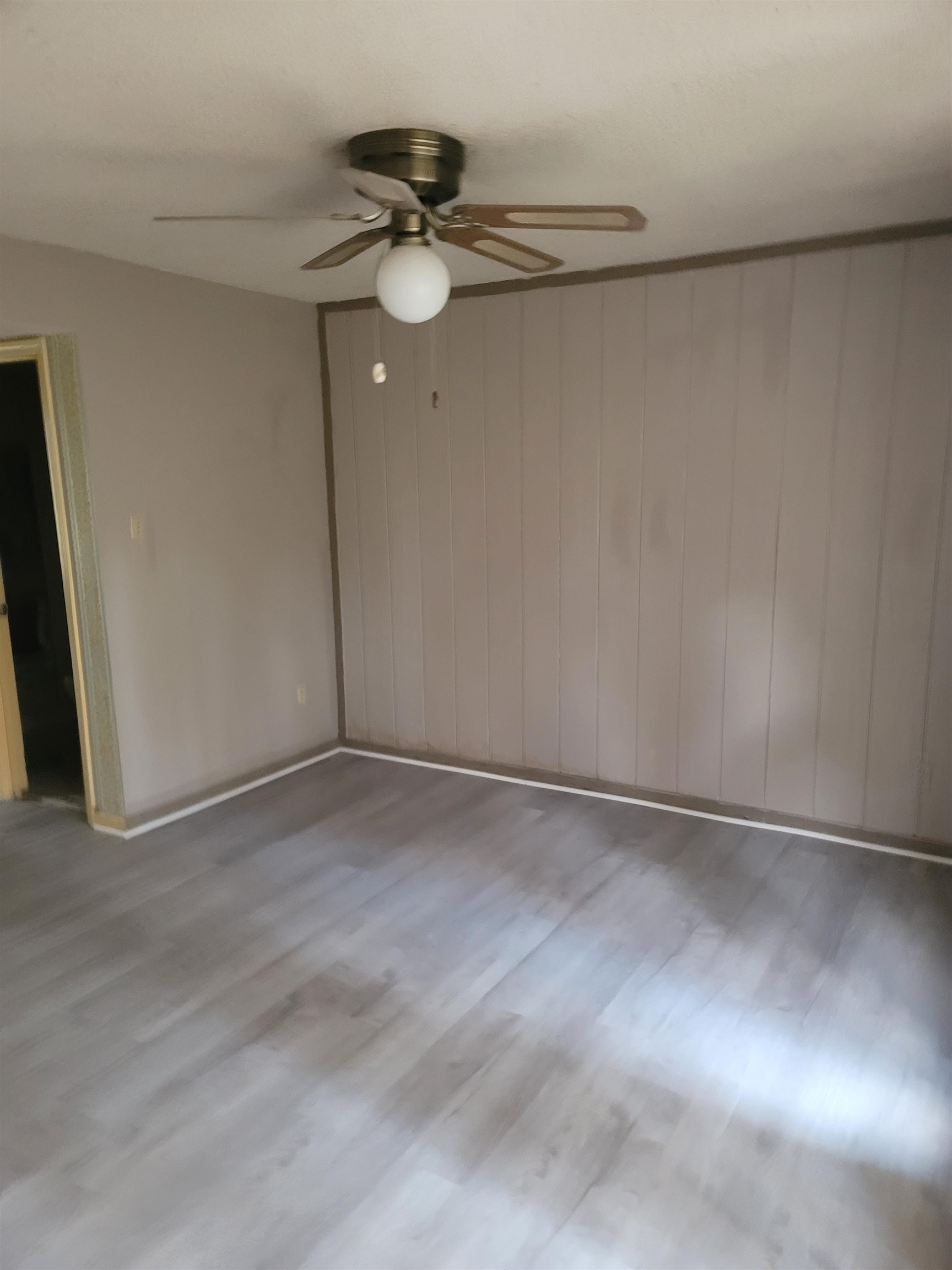 5252 Johns River Road, Unit 5252 Memphis, TN 38116 - Photo 3 of 12 a view of an empty room and chandelier fan