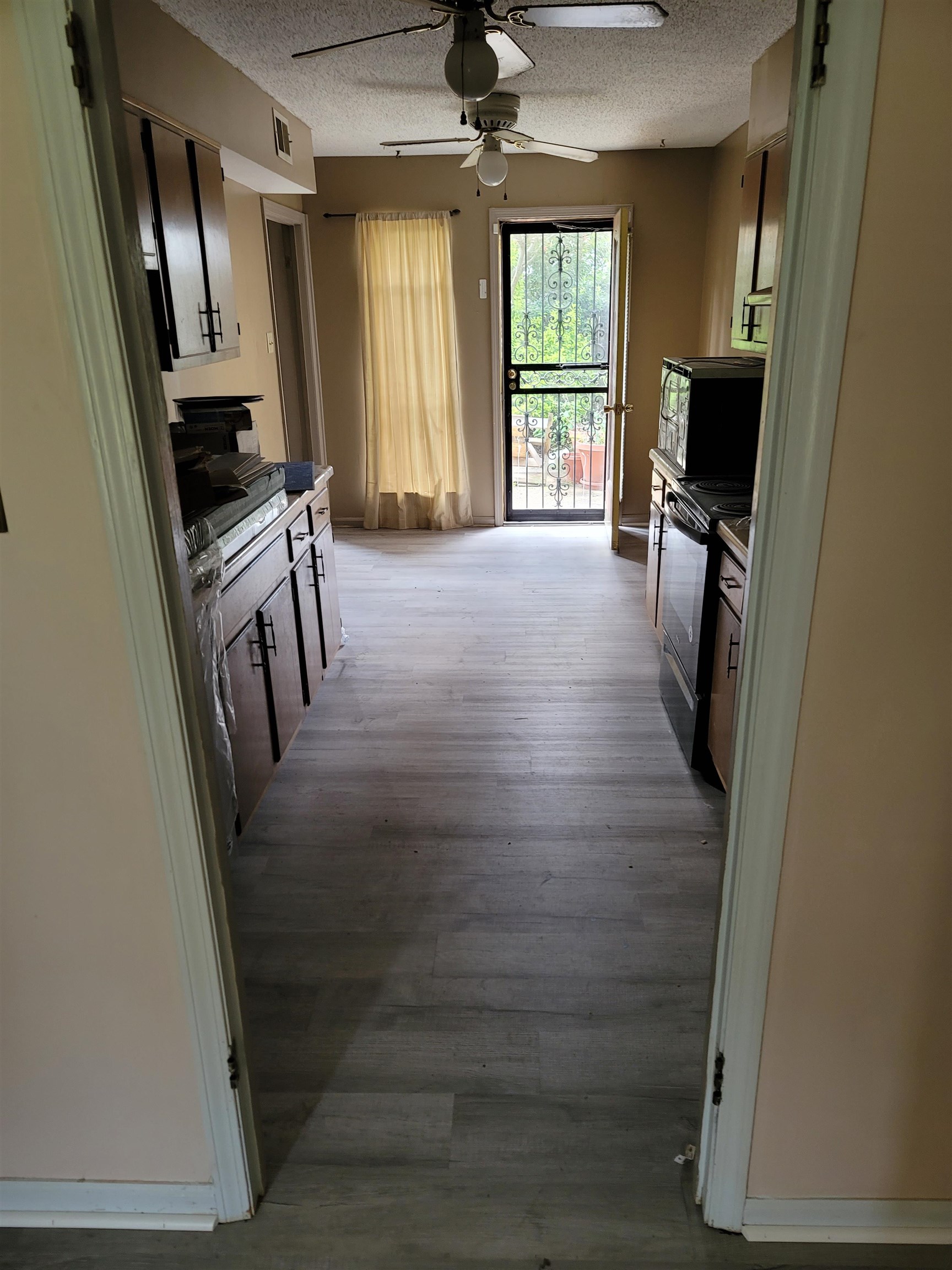 5252 Johns River Road, Unit 5252 Memphis, TN 38116 - Photo 4 of 12 a view of a hallway with wooden floor and windows