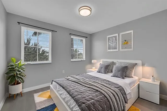 a bedroom with bed and a window