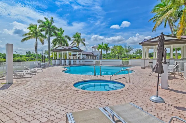 a view of a swimming pool with a patio