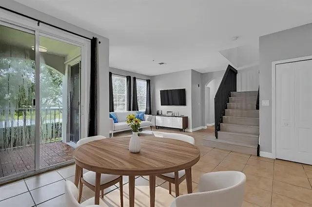 a view of a room with furniture and wooden floor