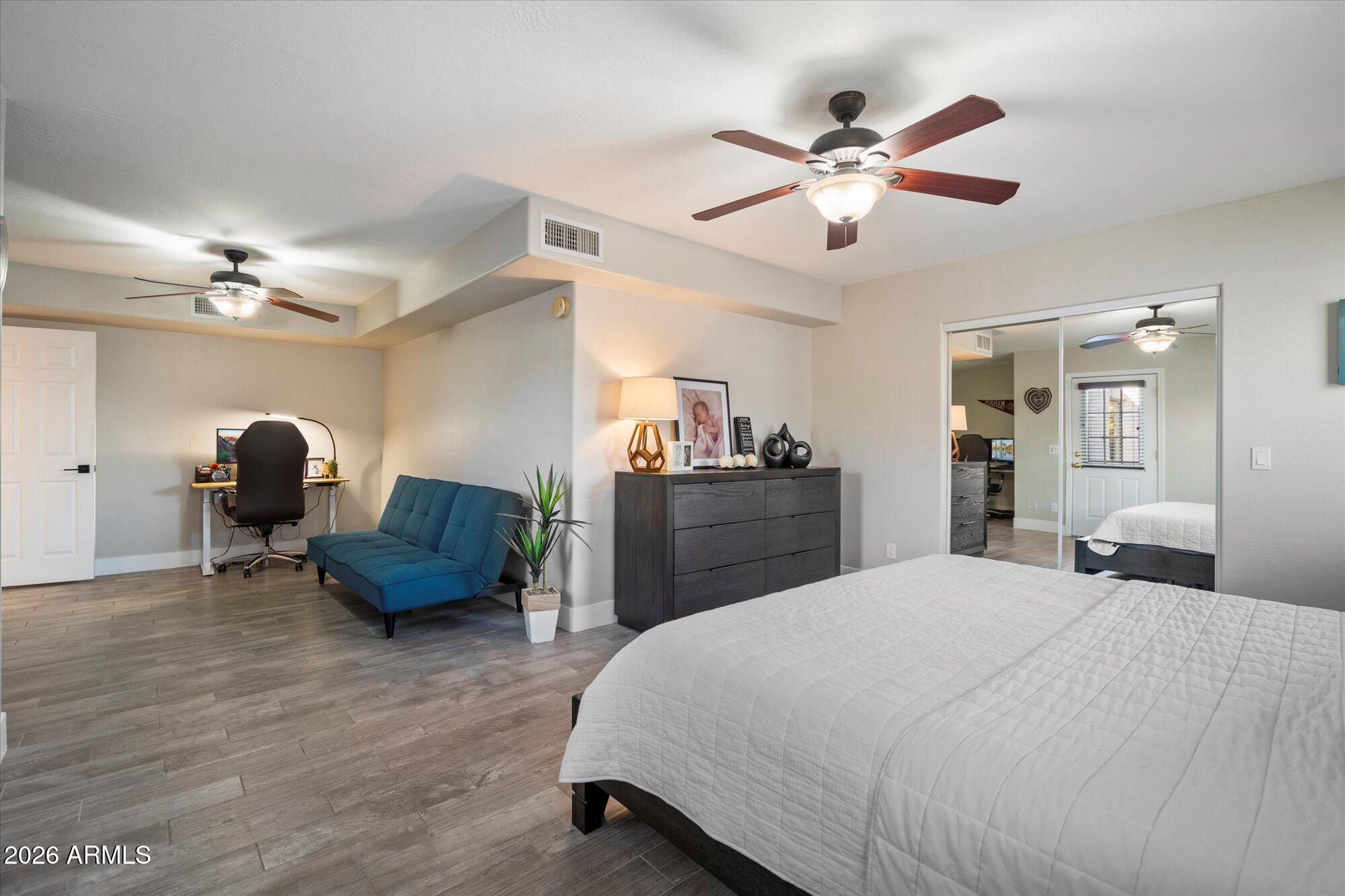 10245 North 34th Place Phoenix, AZ 85028 - Photo 11 of 27 a bedroom with a bed and ceiling fan
