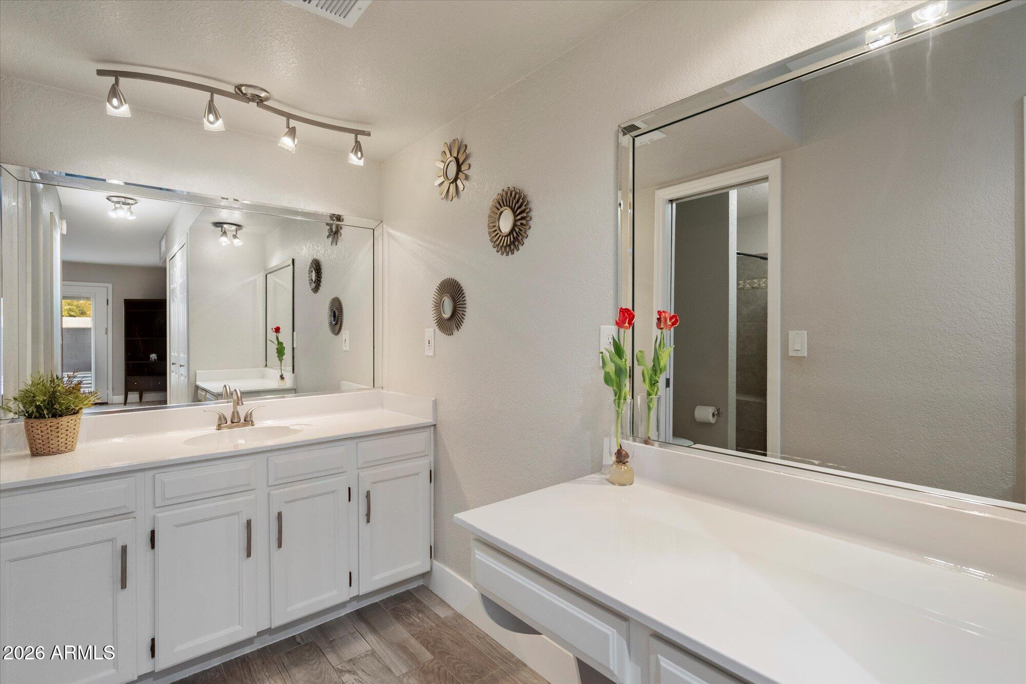 10245 North 34th Place Phoenix, AZ 85028 - Photo 16 of 27 a bathroom with a sink and a mirror