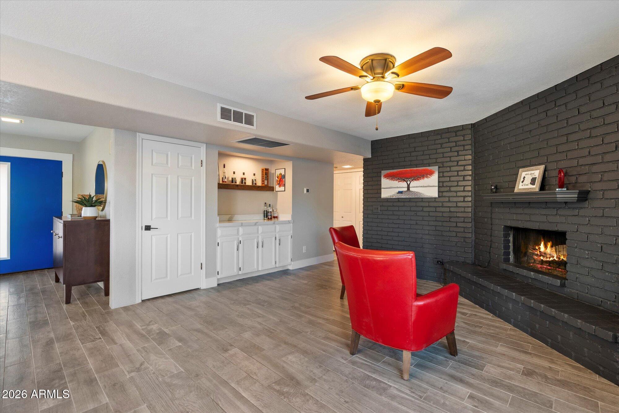 10245 North 34th Place Phoenix, AZ 85028 - Photo 10 of 27 a living room with furniture and a fireplace