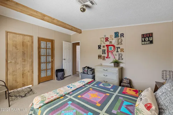 a bed room with a bed and a couch