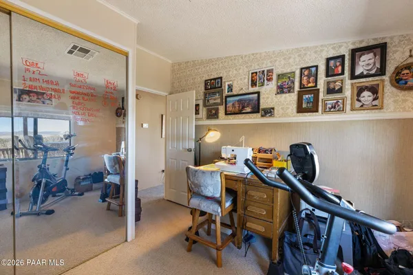 a living room with lots of furniture and air hockey table