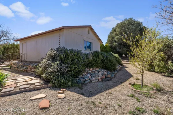 a backyard of a house with lots of green space