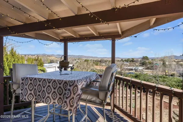 a view of a balcony with furniture