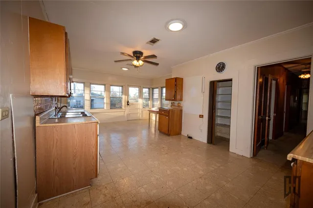 a view of a kitchen with a sink and a window