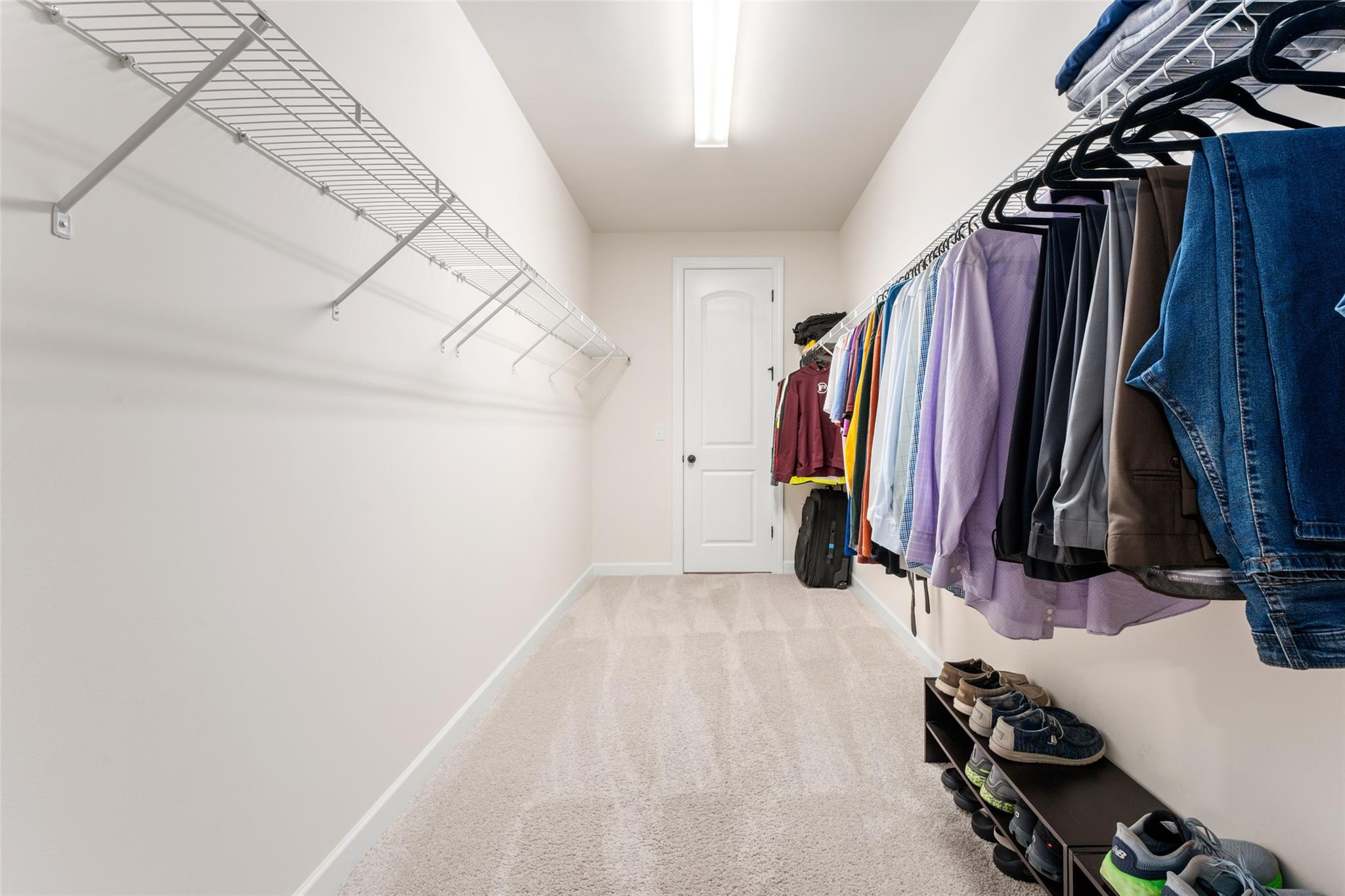 1288 Independence Street Tega Cay, SC 29708 - Photo 23 of 37 a view of walk in closet with clothes