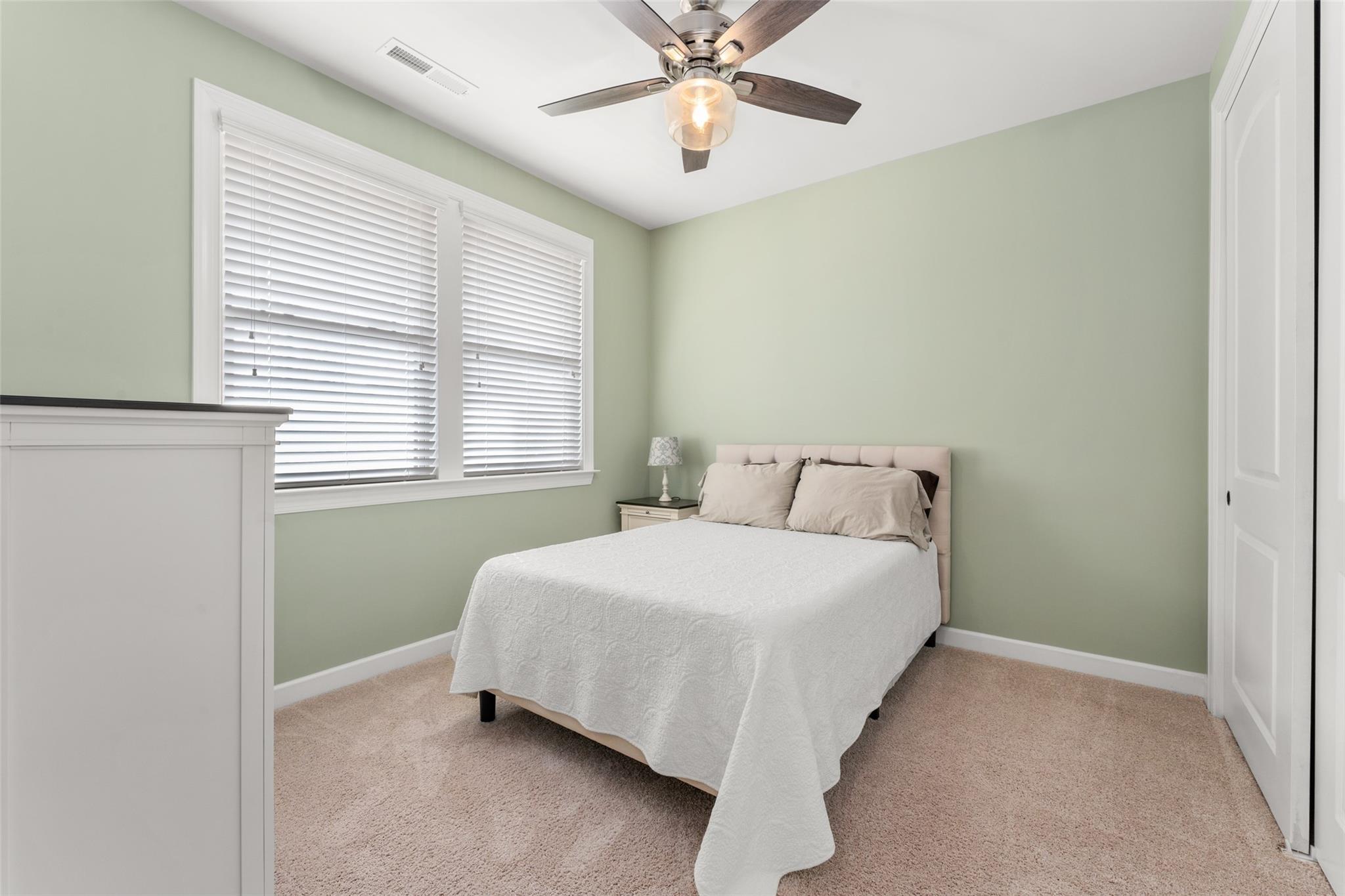 1288 Independence Street Tega Cay, SC 29708 - Photo 30 of 37 a bedroom with a bed and window