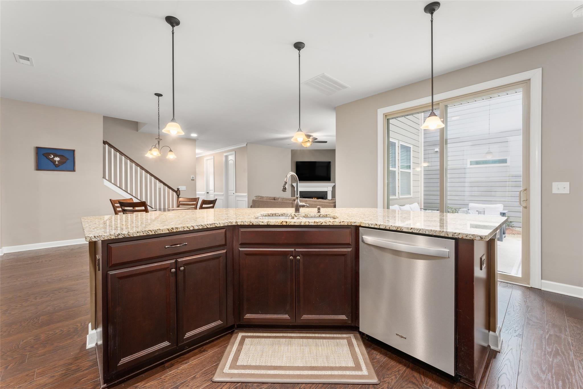 1288 Independence Street Tega Cay, SC 29708 - Photo 9 of 37 a kitchen with kitchen island a sink stainless steel appliances and a window
