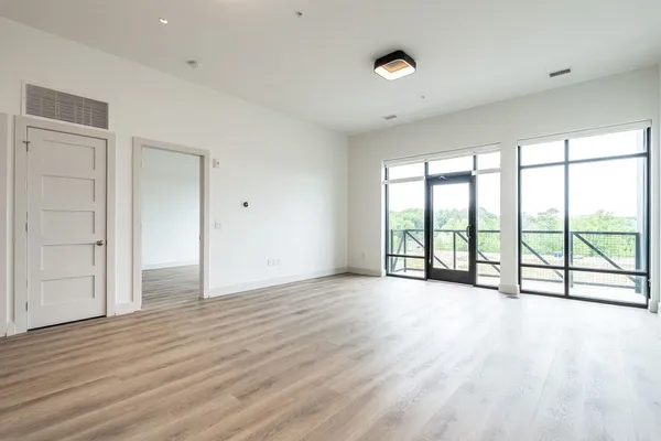 a kitchen with a refrigerator and a stove top oven