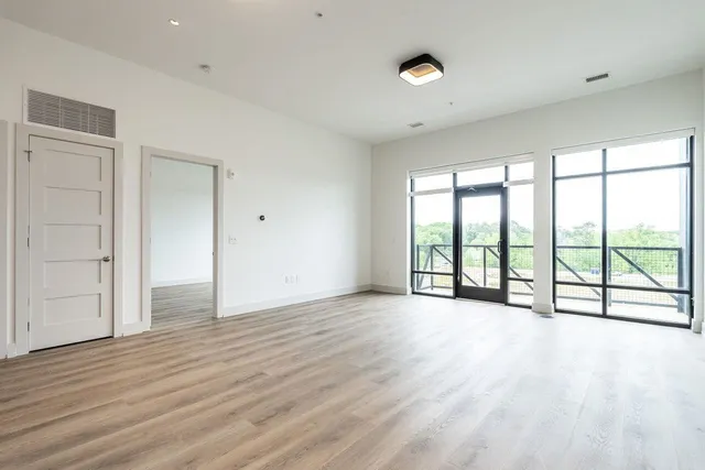 a kitchen with a refrigerator and a stove top oven