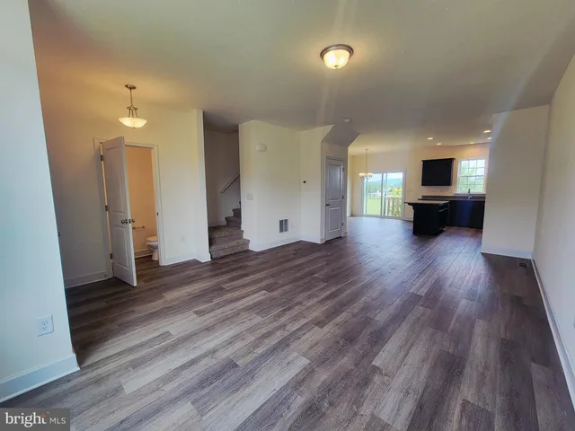 a view of a living room and hardwood floor