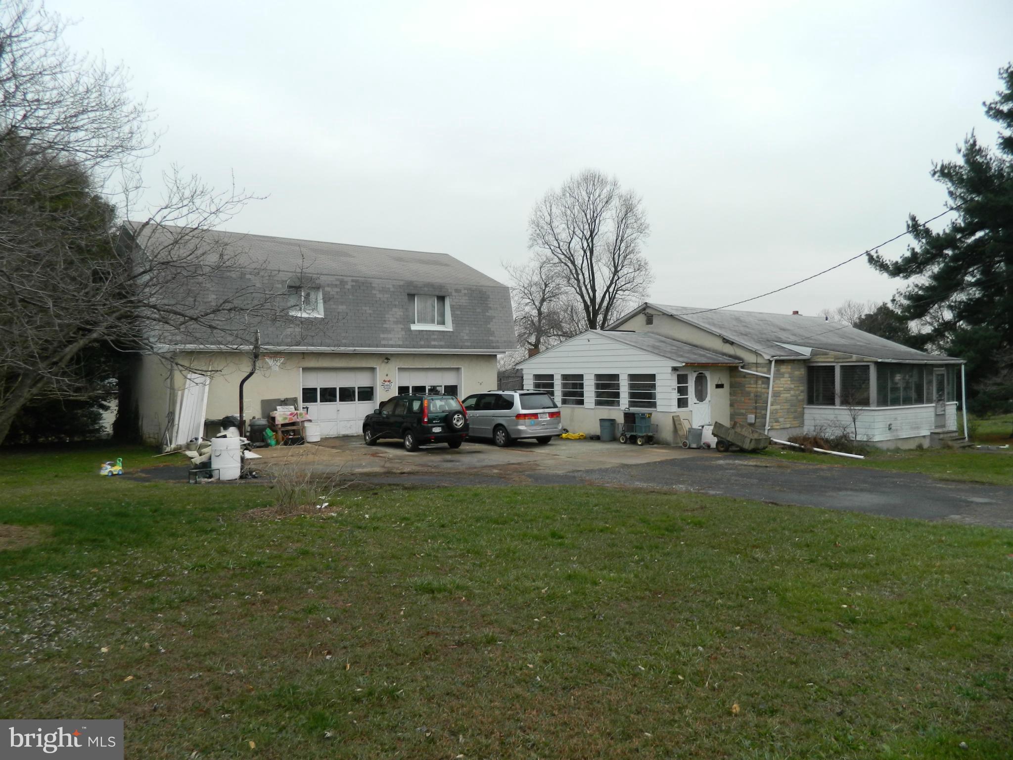 5708 Hilltop Road Baltimore, MD 21220 - Photo 1 of 10 a view of a big house with a big yard and large trees