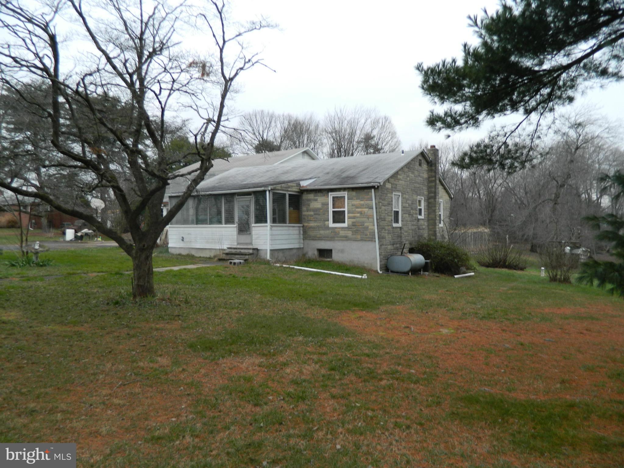 5708 Hilltop Road Baltimore, MD 21220 - Photo 2 of 10 a view of a yard in front of house