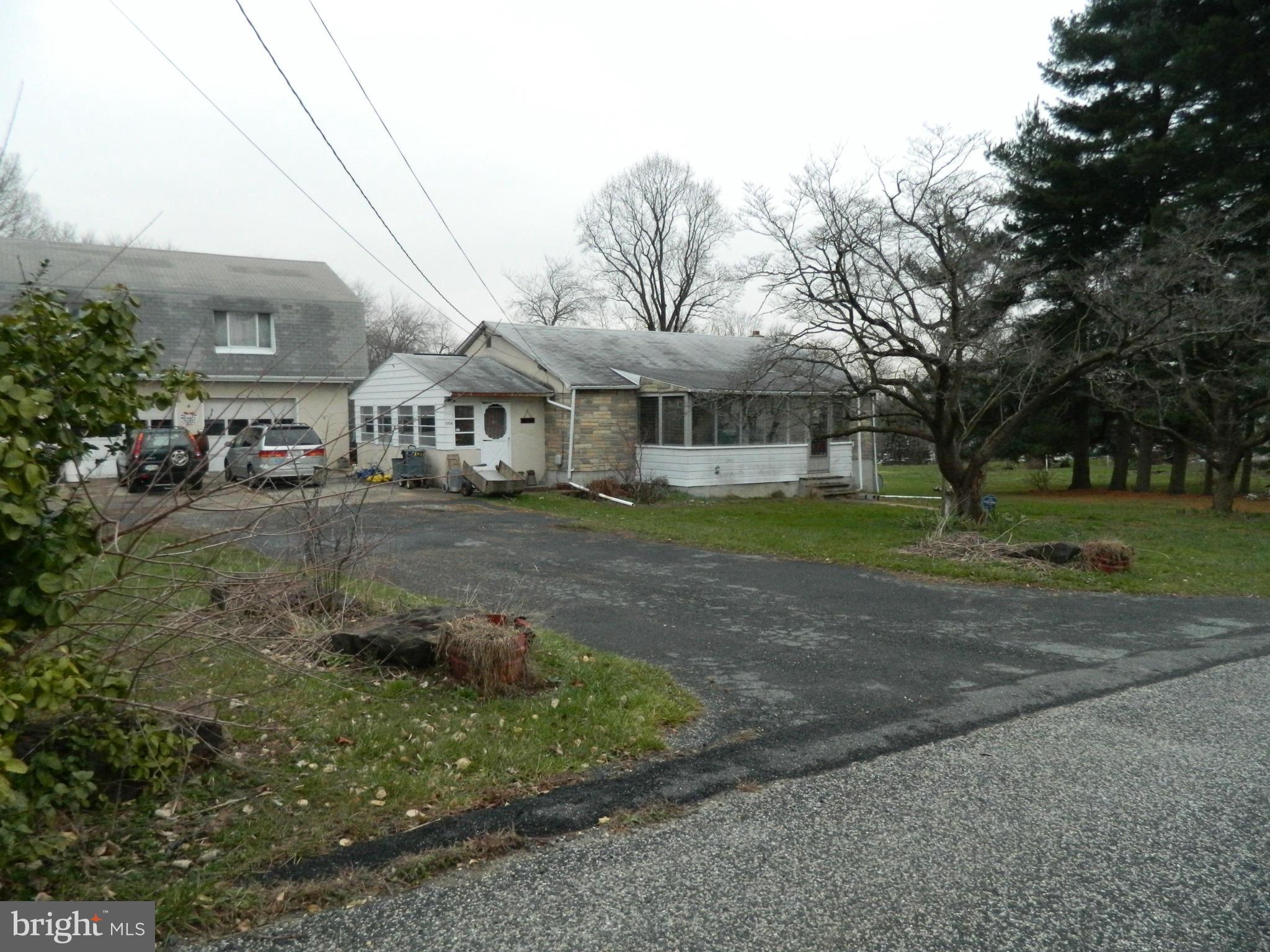 5708 Hilltop Road Baltimore, MD 21220 - Photo 6 of 10 a front view of a house with a yard