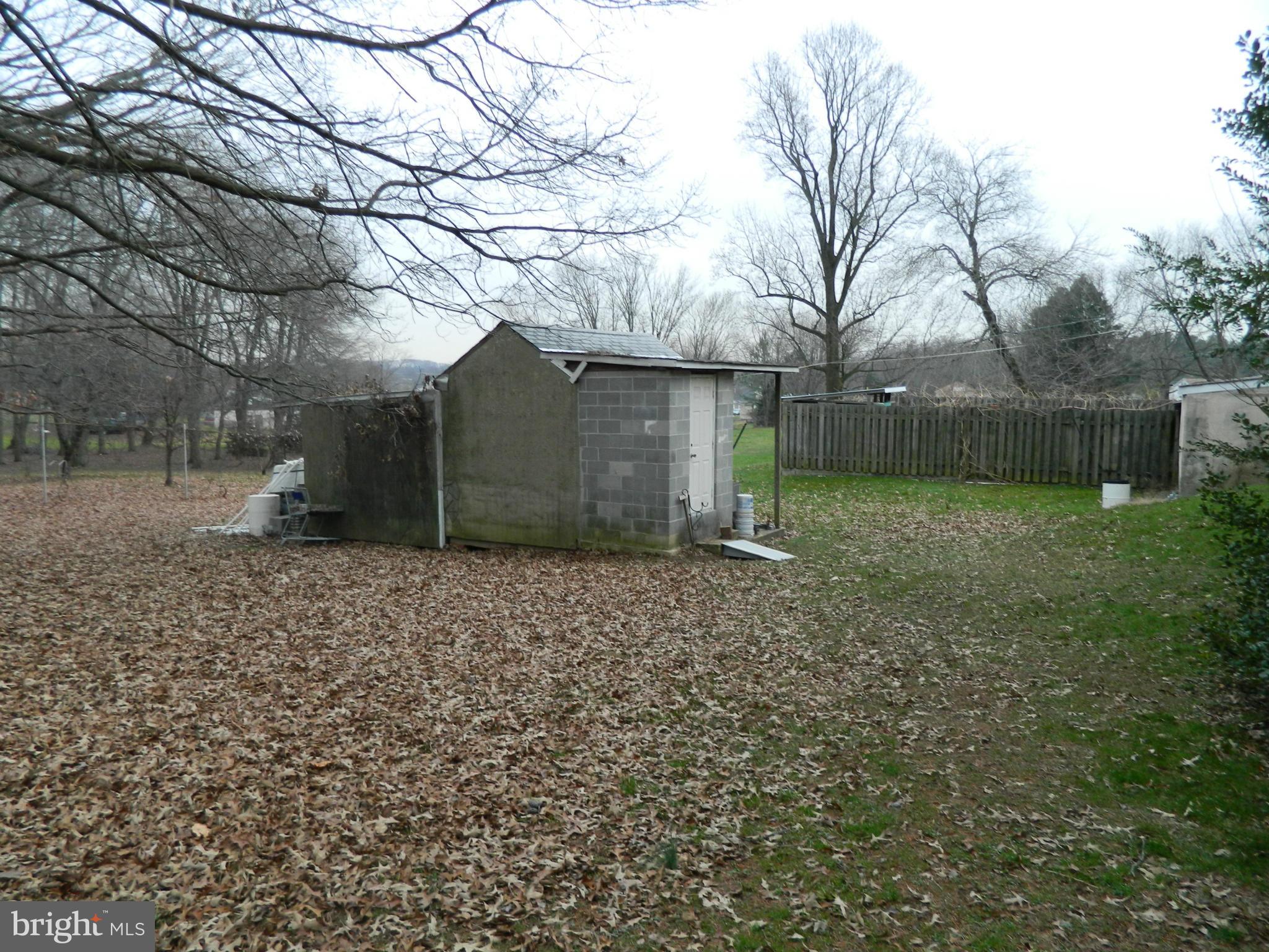 5708 Hilltop Road Baltimore, MD 21220 - Photo 8 of 10 a backyard of a house with lots of green space
