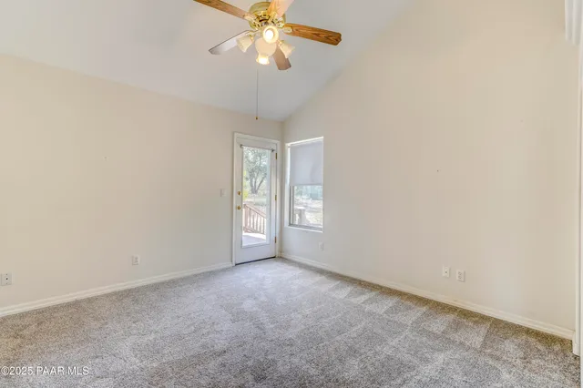 a view of a roof deck with wooden floor and fence