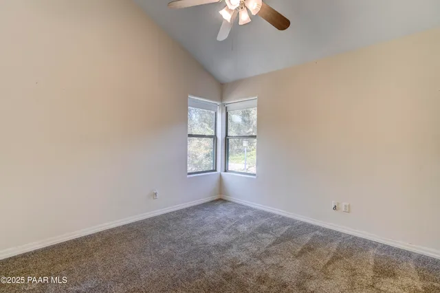 a view of a chairs and table on the deck
