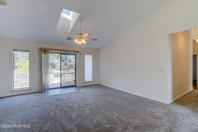 a view of a house with a mountain in the background