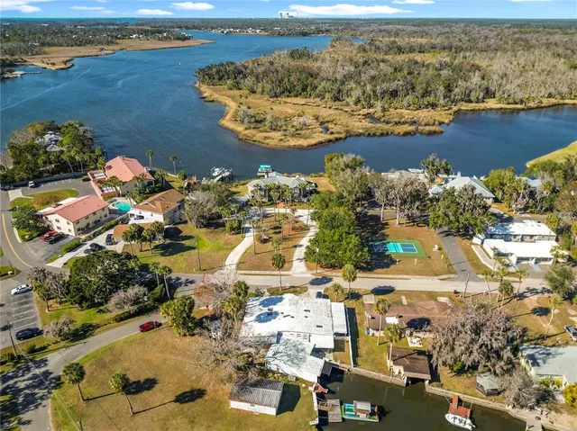 an aerial view of a house with a ocean view