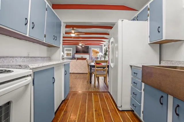 a kitchen with a sink and wooden cabinets