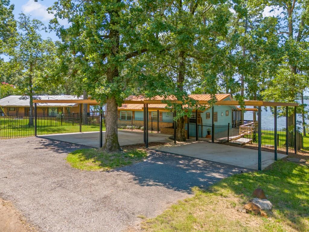 263 Crestwood Loop Avinger, TX 75630 - Photo 2 of 40 a view of a park with large trees