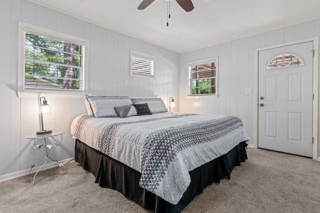 263 Crestwood Loop Avinger, TX 75630 - Photo 21 of 40 a bedroom with a bed and a window