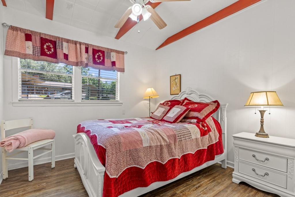 263 Crestwood Loop Avinger, TX 75630 - Photo 22 of 40 a bedroom with a bed and a window