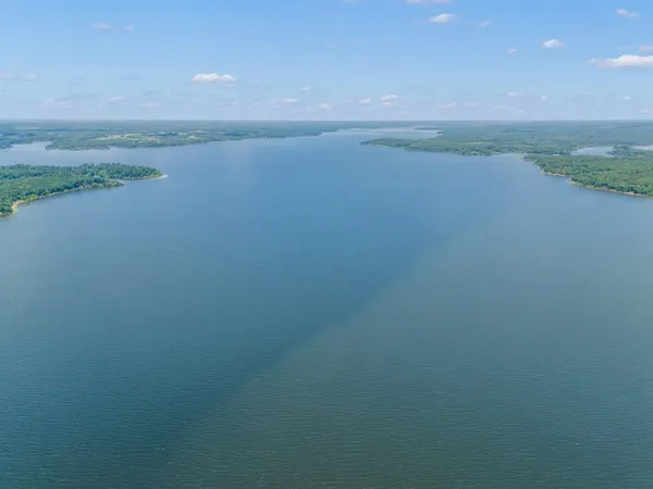 a view of a lake with a big yard