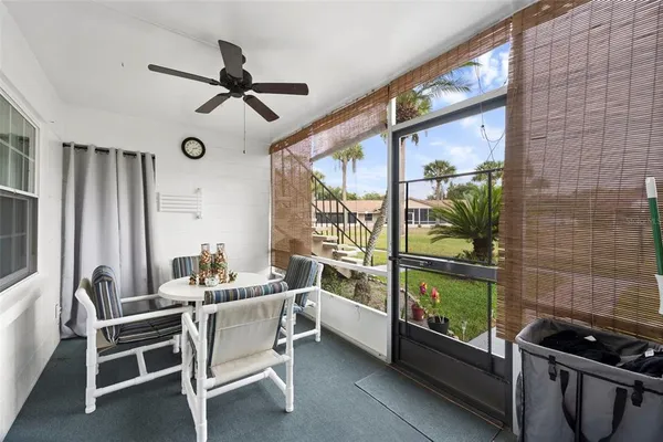 a dining room with furniture and a window