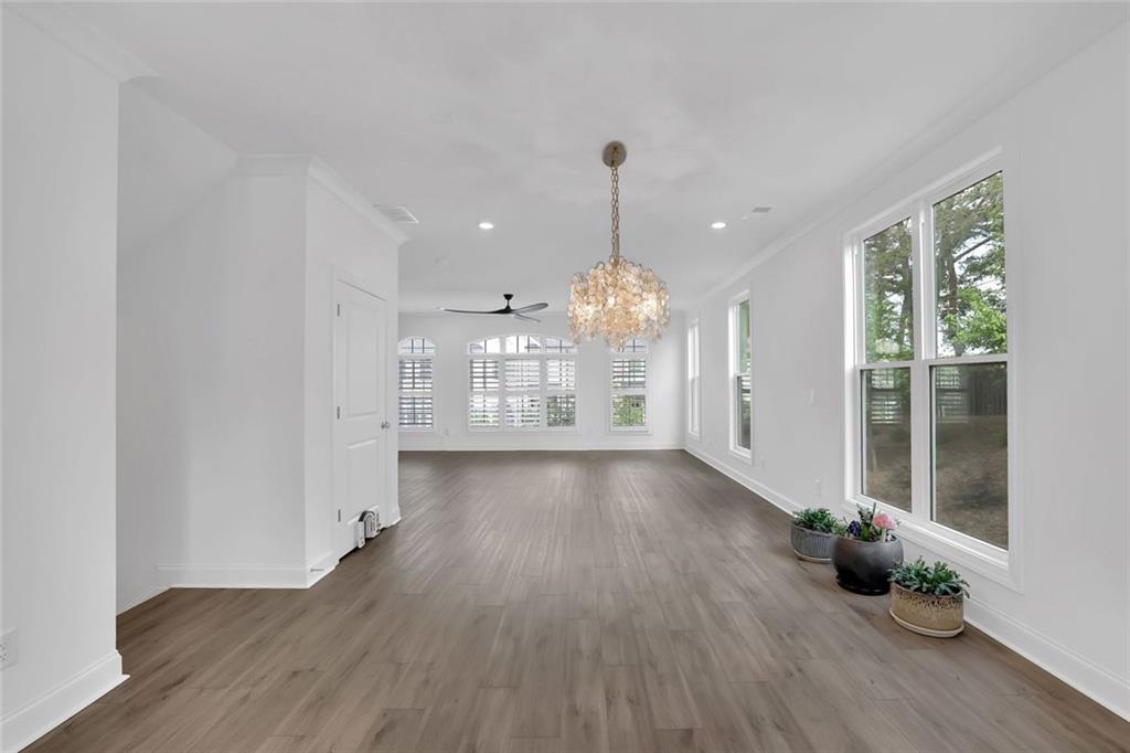 3106 Moor View Road Duluth, GA 30096 - Photo 22 of 57 a view of an empty room with wooden floor and a window
