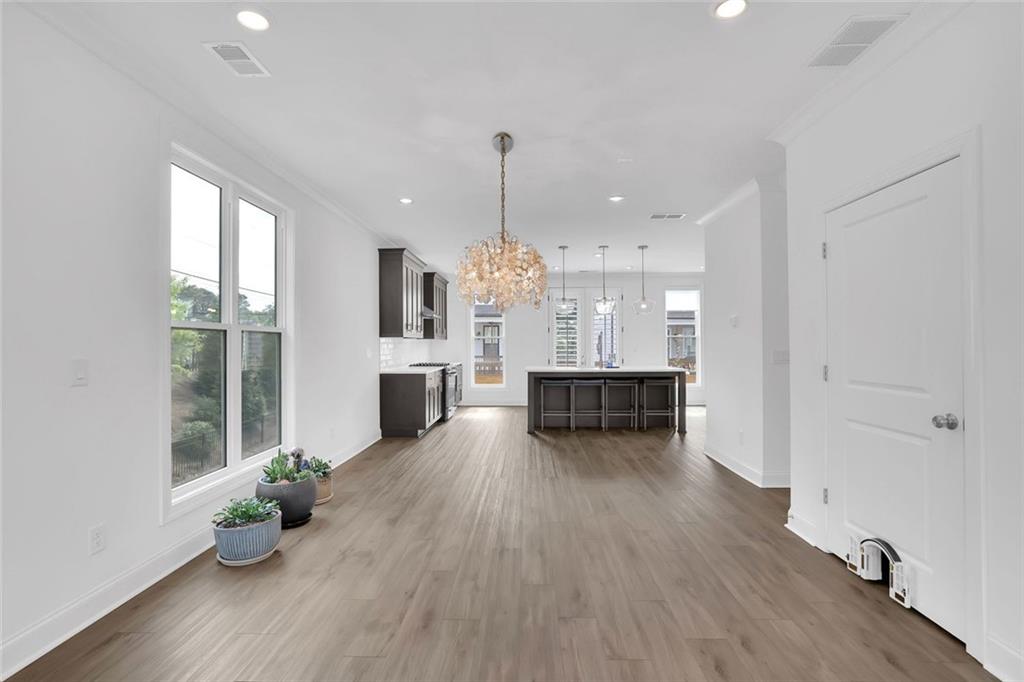 3106 Moor View Road Duluth, GA 30096 - Photo 23 of 57 a room with furniture and a chandelier
